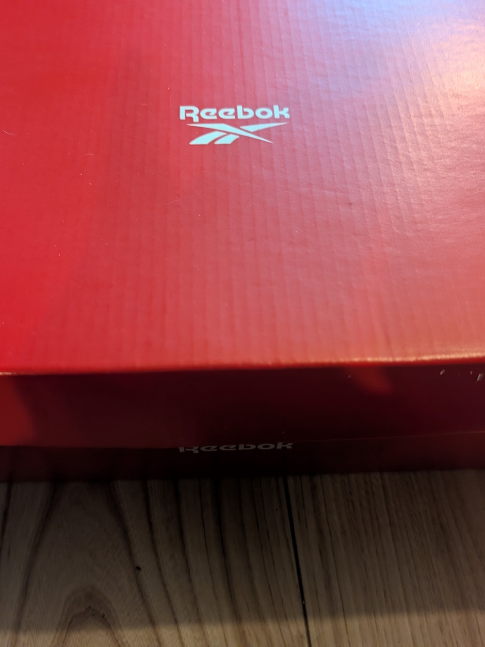 Reebok Red Box with White Label and Black Text